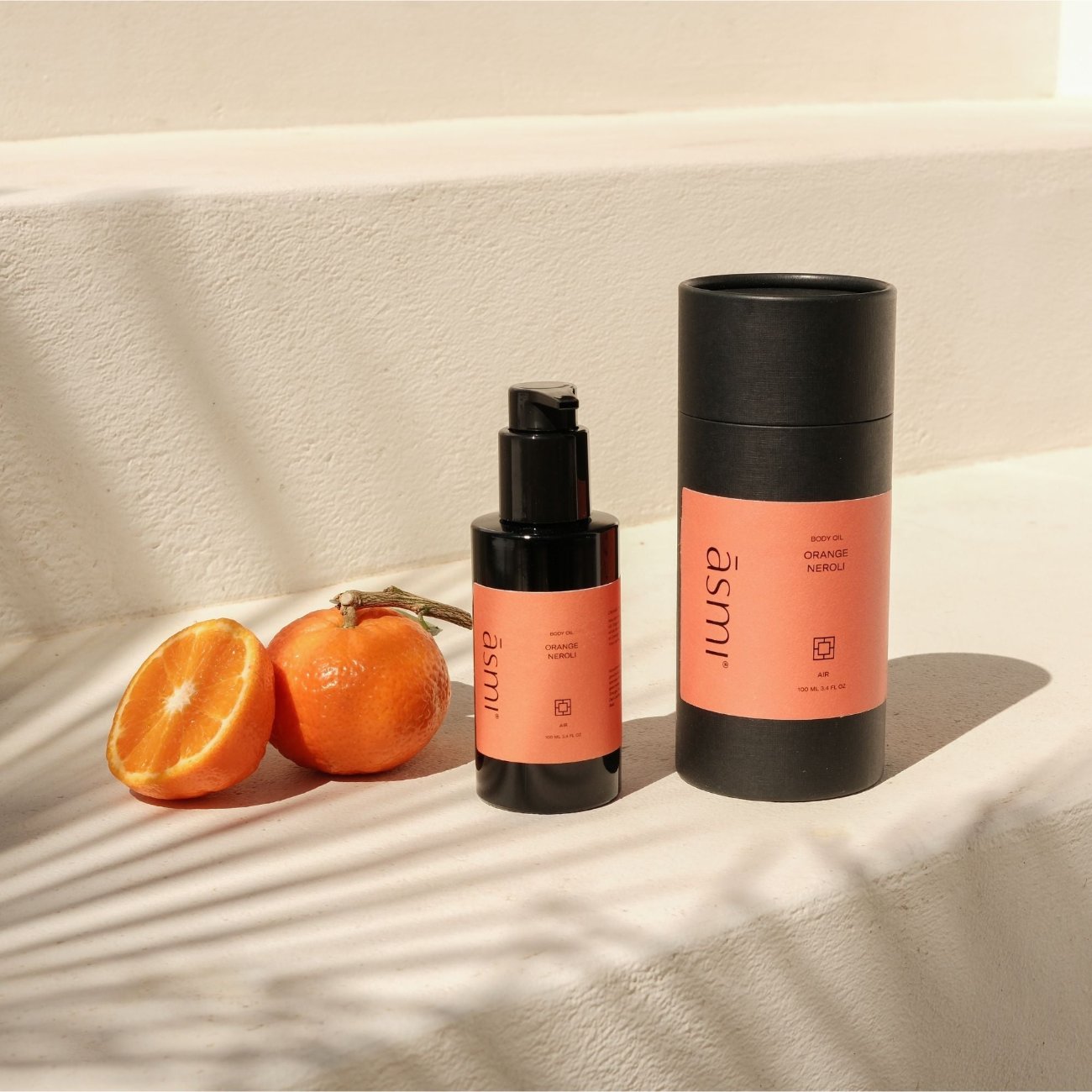 ASMI AYURVEDA erfrischendes Körperöl mit Mandelöl und Kokosöl 100ml Flasche, Kartonage und Orangen